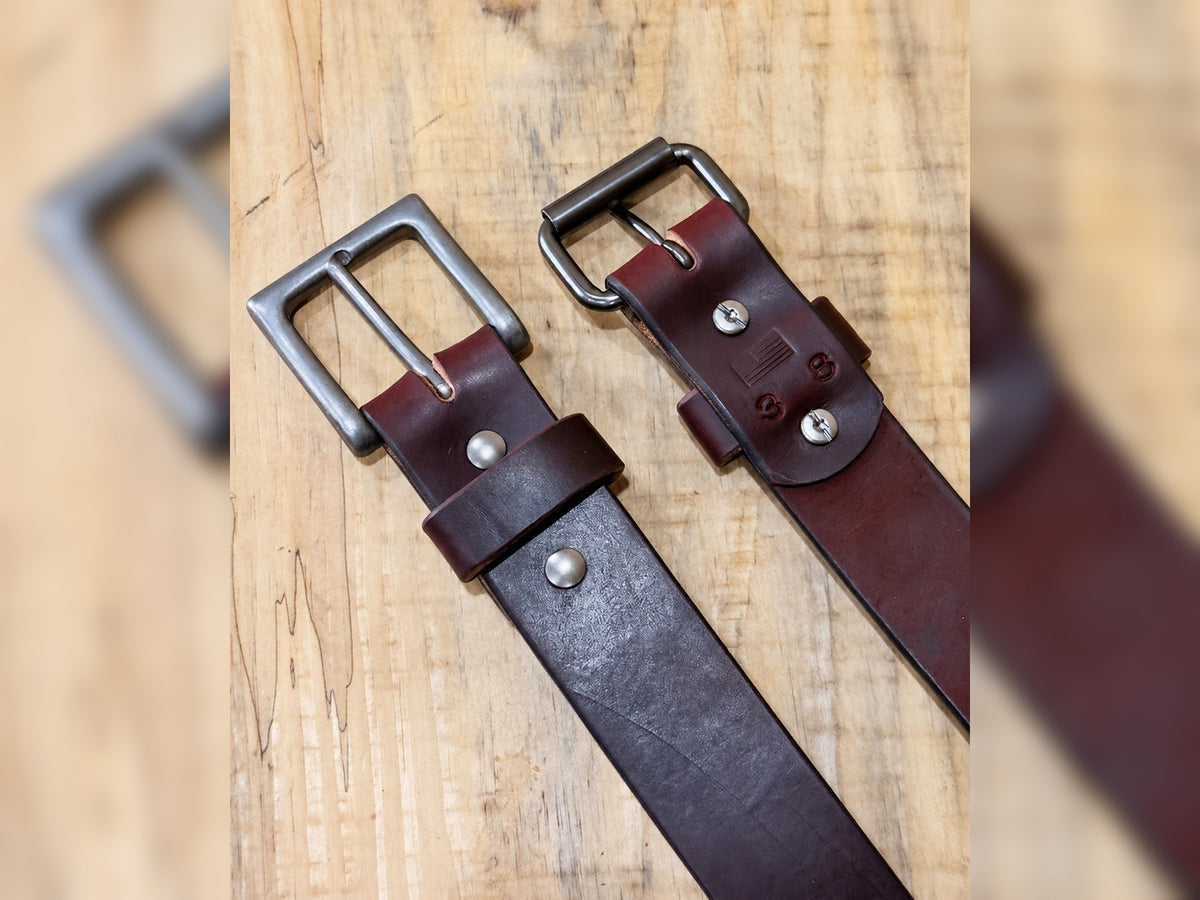 Front and back construction of the burgundy latigo belt showing Chicago screws and maker stamp