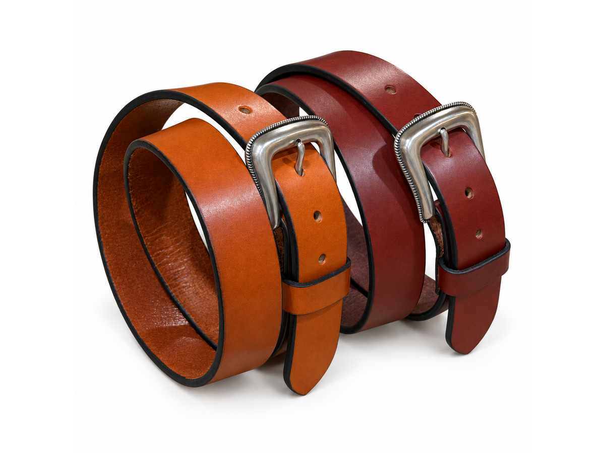 Angled view of Bourbon and Chestnut bridle leather belts with Roped Edge buckles