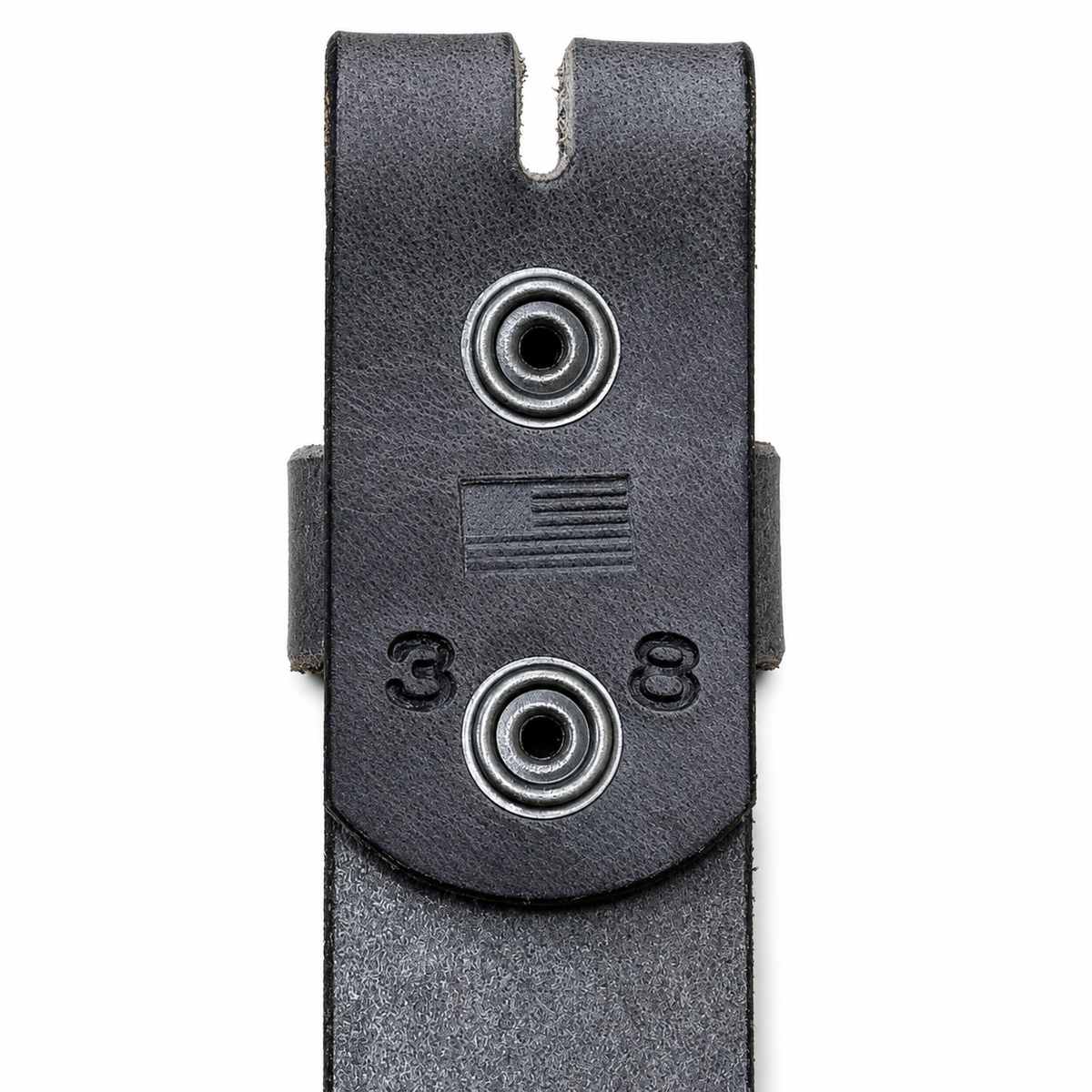 Close-up of a black leather belt clip or holster with two circular metal loops, an embossed American flag, and the numbers 3 and 8 on a white background.