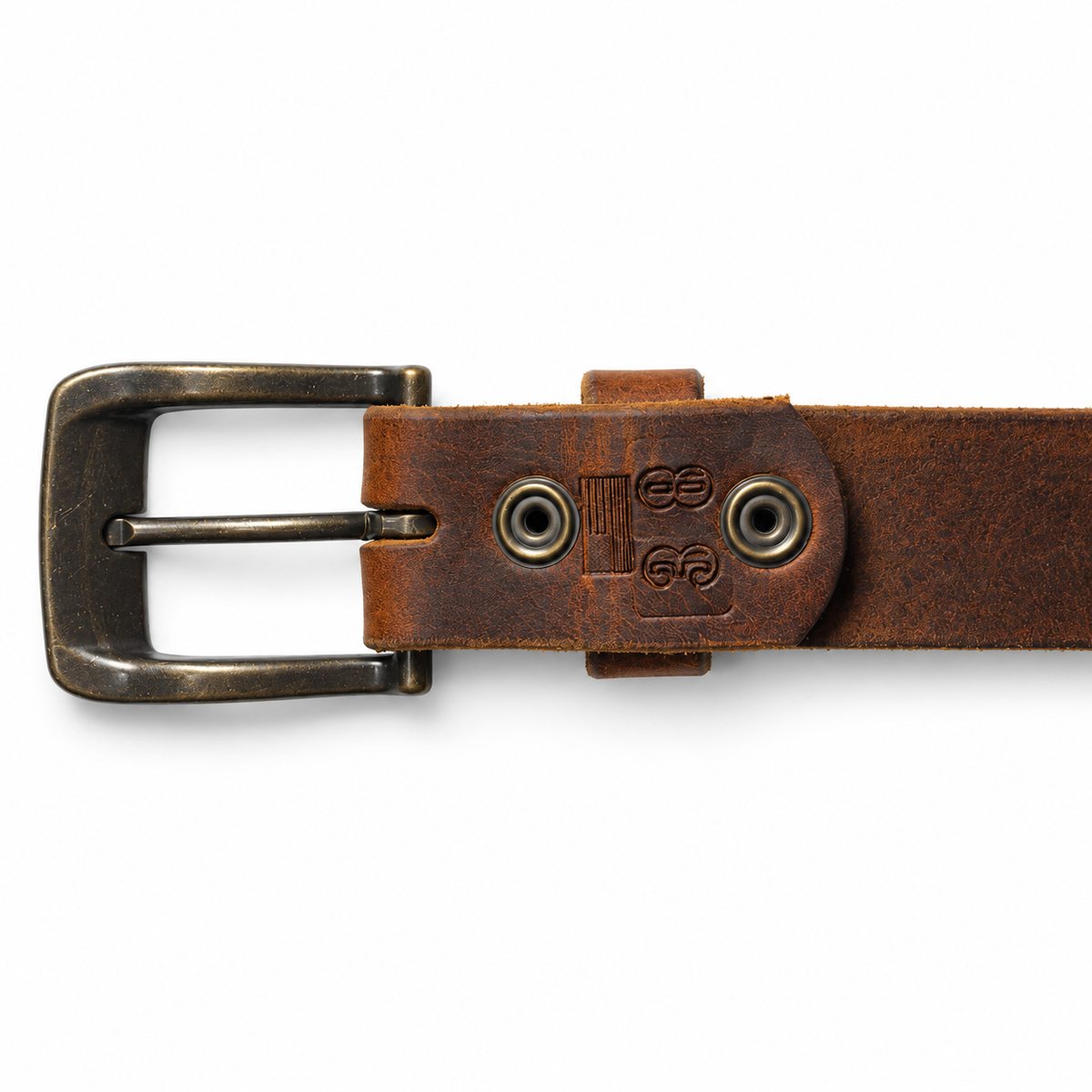 A close-up of a brown leather belt with an antique bronze metal buckle, set against a plain white background.