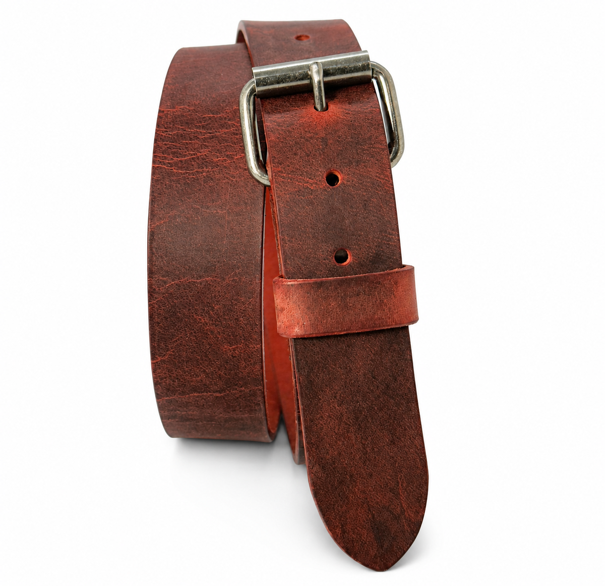 Chestnut Crazy Horse leather belt standing coiled with an antique nickel roller buckle and fitting holes visible.