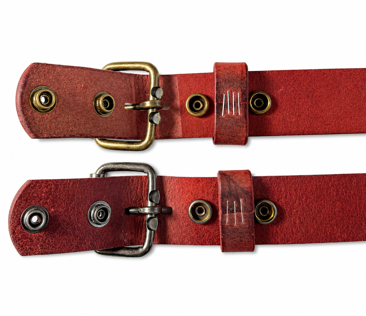Undersides of two chestnut Crazy Horse leather belts with snap closures opened beside antique brass and antique nickel roller buckles.