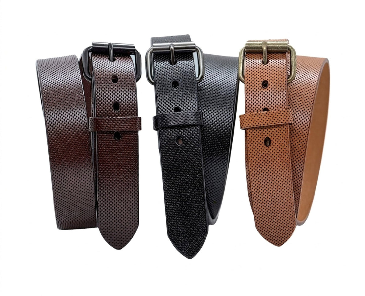 American steer hide pinhole leather belts in brown, black, and tan, standing coiled with roller buckles on white.
