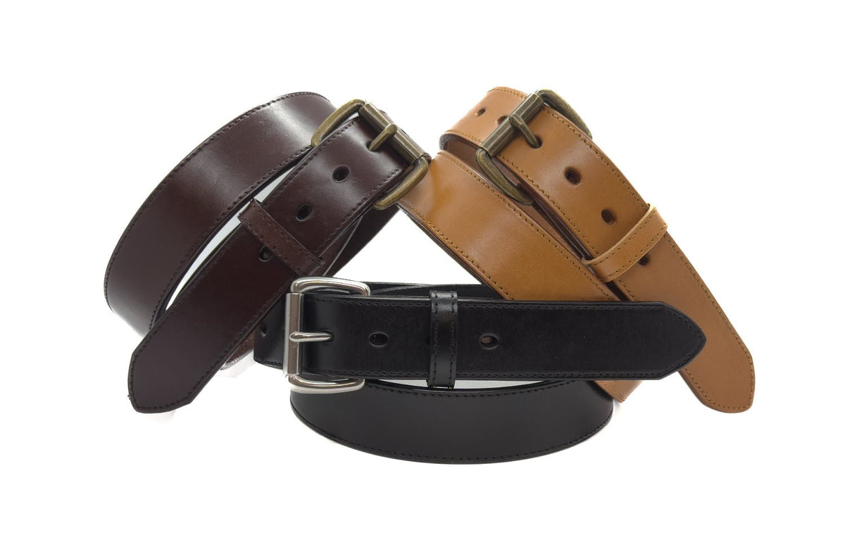 Brown, tan, and black stitched-edge steer hide leather belts with brass-tone and silver-tone buckles.