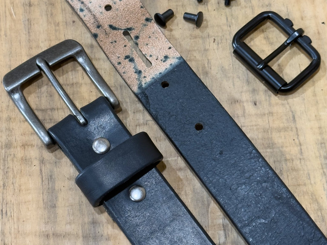 Black harness belt shown from the side to highlight its 13–14oz thickness.