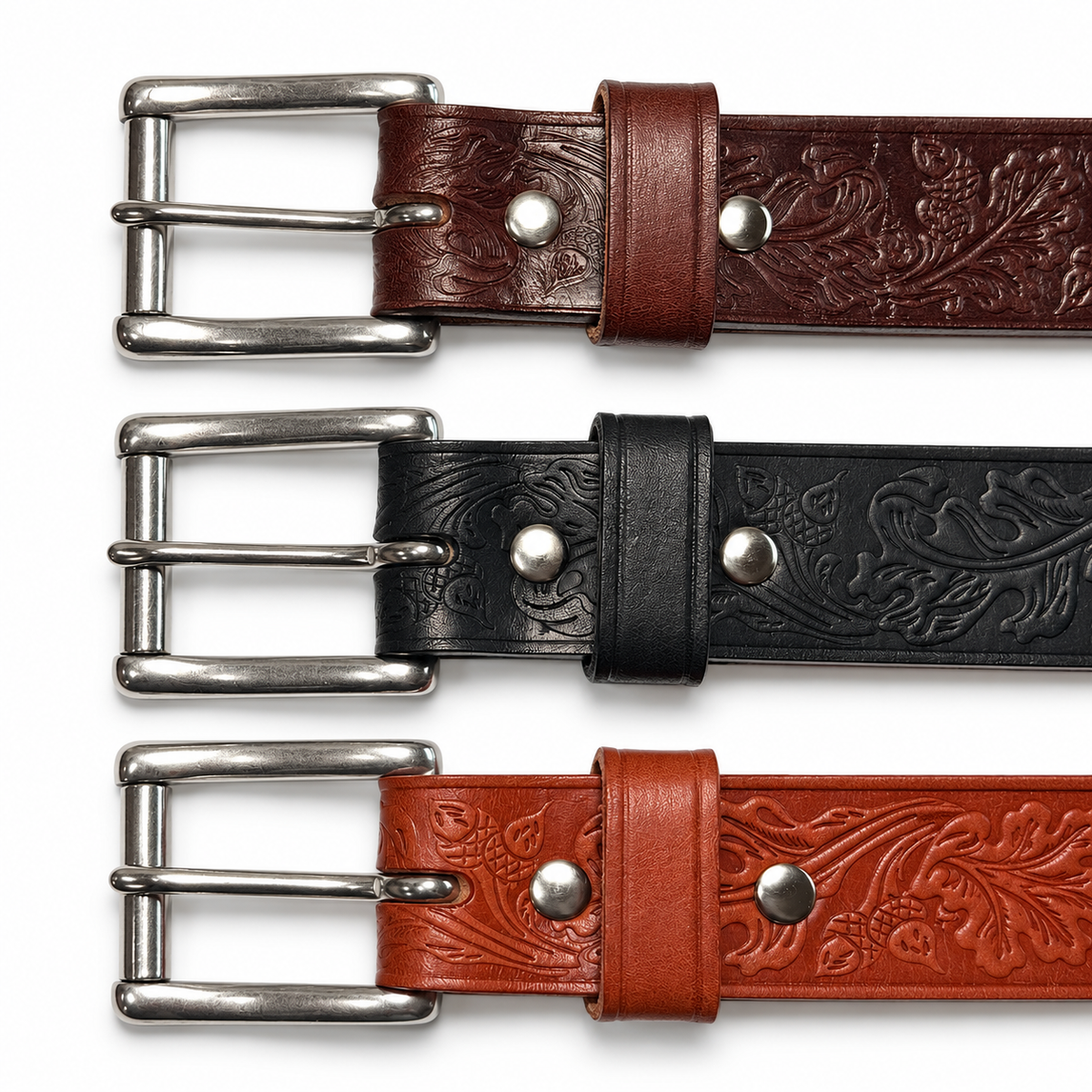 Front buckle details on brown, black, and tan embossed leather belts, showing stainless steel roller buckles and matching keepers.