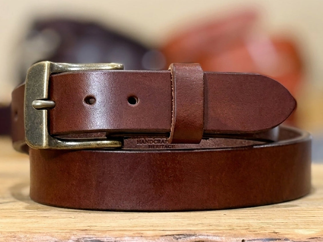 Brown harness belt shown from the side to highlight its 13–14oz thickness