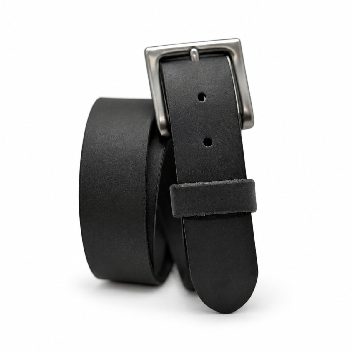 Black Crazy Horse leather belt standing coiled with a Heavy Gunmetal Pin buckle on white.