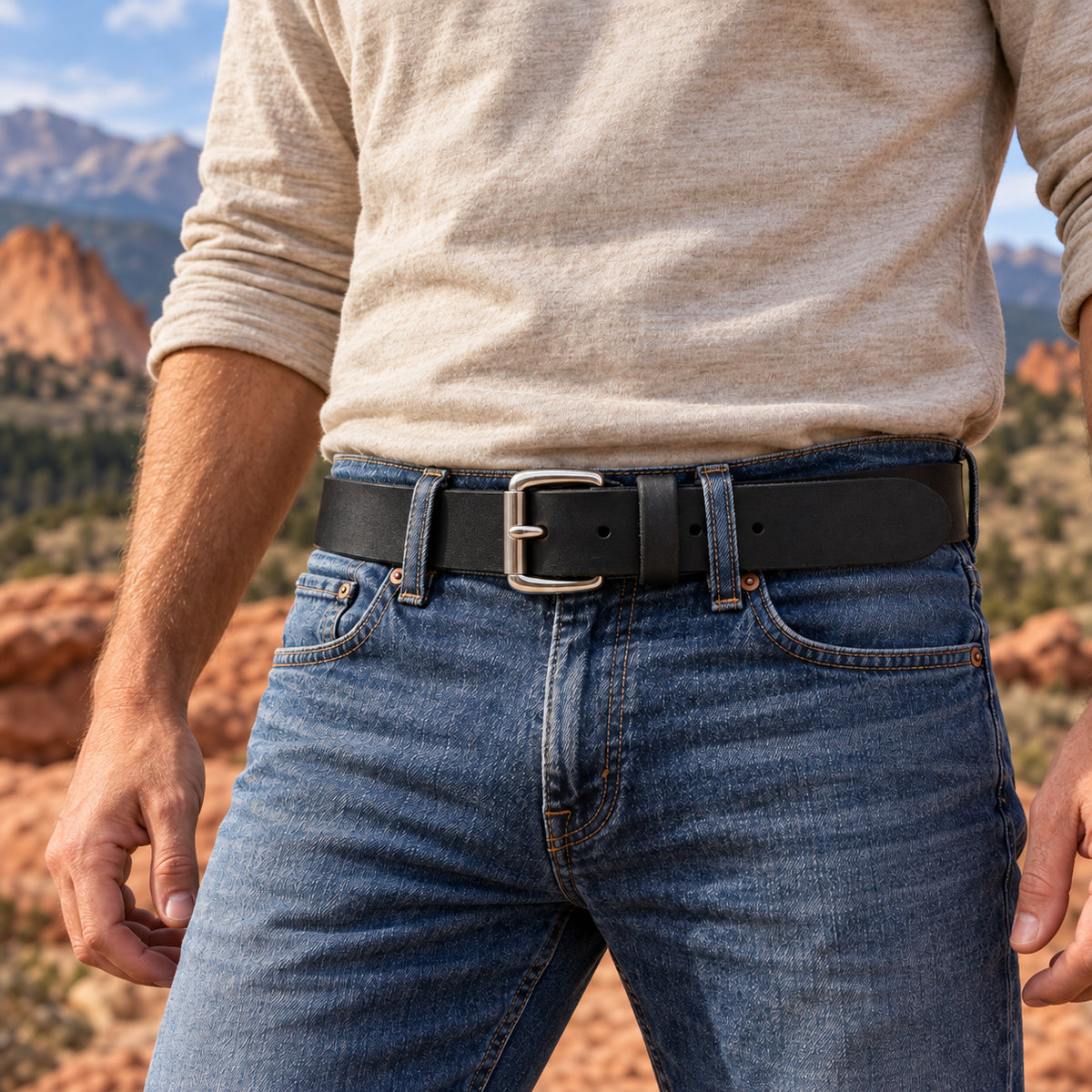 Black Crazy Horse full-grain buffalo leather belt with a Stainless Steel Roller buckle, worn with blue jeans outdoors.