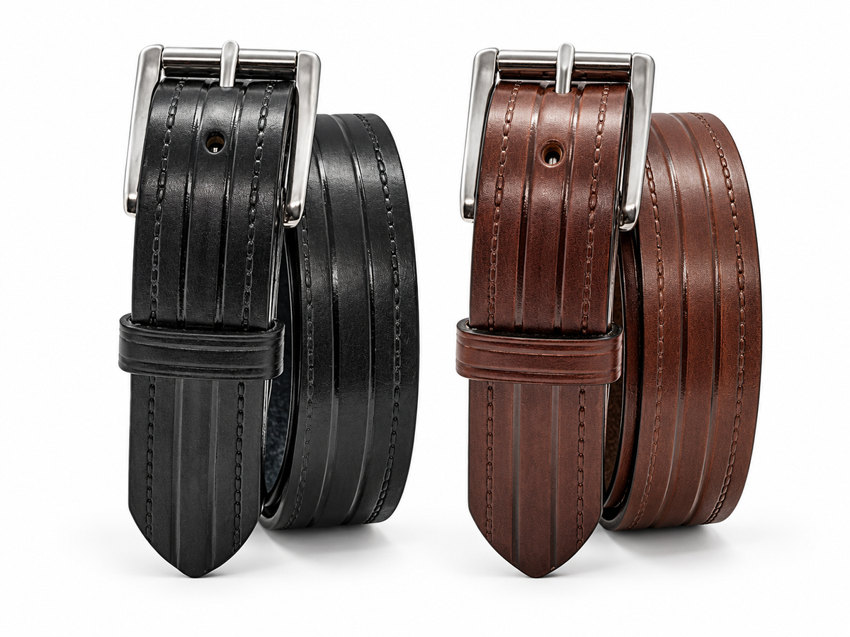 Black and brown Rancher 1.5-inch Amish-made heavy-duty leather belts with embossed lines and silver roller buckles on white.