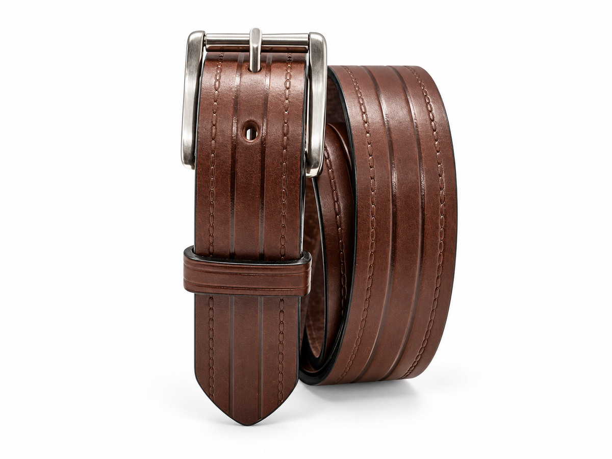Brown Rancher 1.5-inch Amish-made heavy-duty full-grain leather belt with embossed lines and silver roller buckle on a white background.