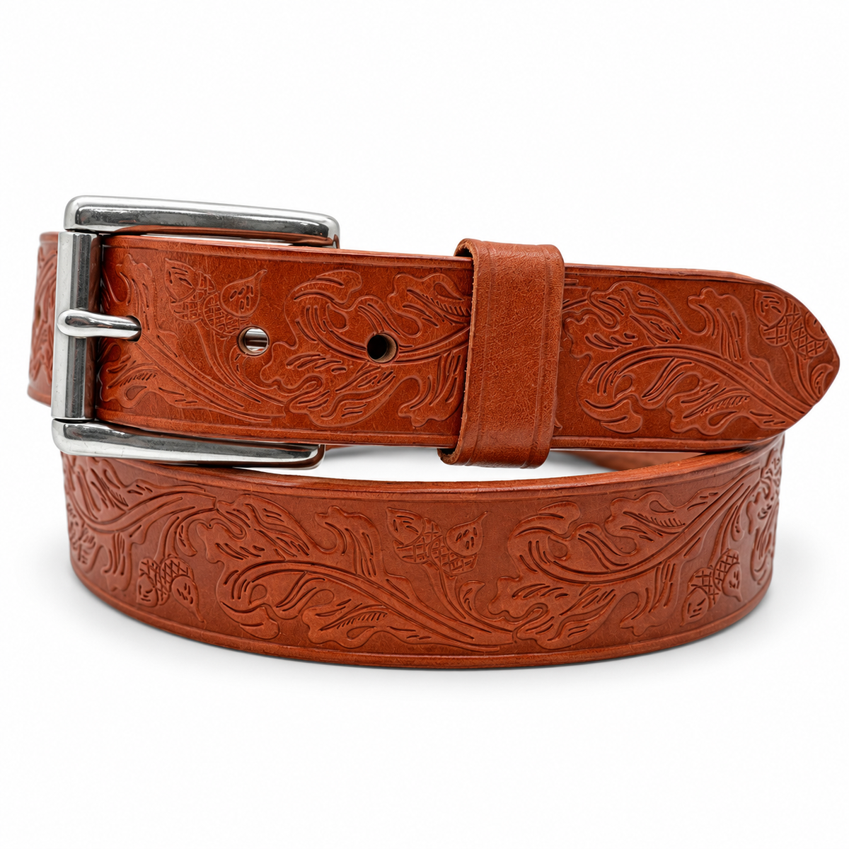Coiled tan full-grain harness leather belt with oak leaf and acorn embossing and a stainless steel roller buckle.