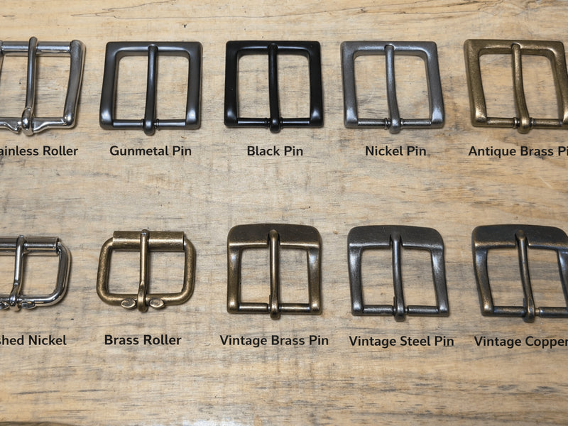 Collection of various metal buckles on a wooden surface with labels indicating type.