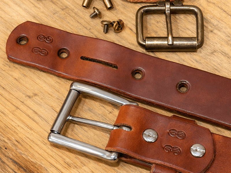 Russet harness belt with Chicago screws removed, showing the detachable buckle, keeper, and screwdriver.